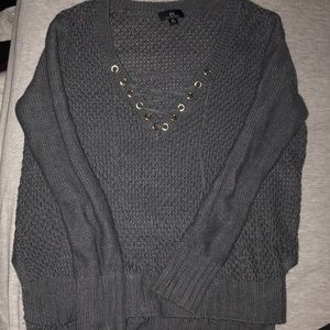 Dark grey v-neck sweater with cross strings